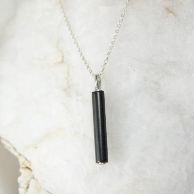 Cylindre d'ébène et son petit secret.